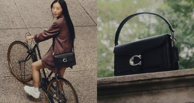 a woman on a bike and a purse on a chair