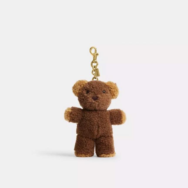 Brown teddy bear keychain with gold-tone lobster clasp and charm attachment.