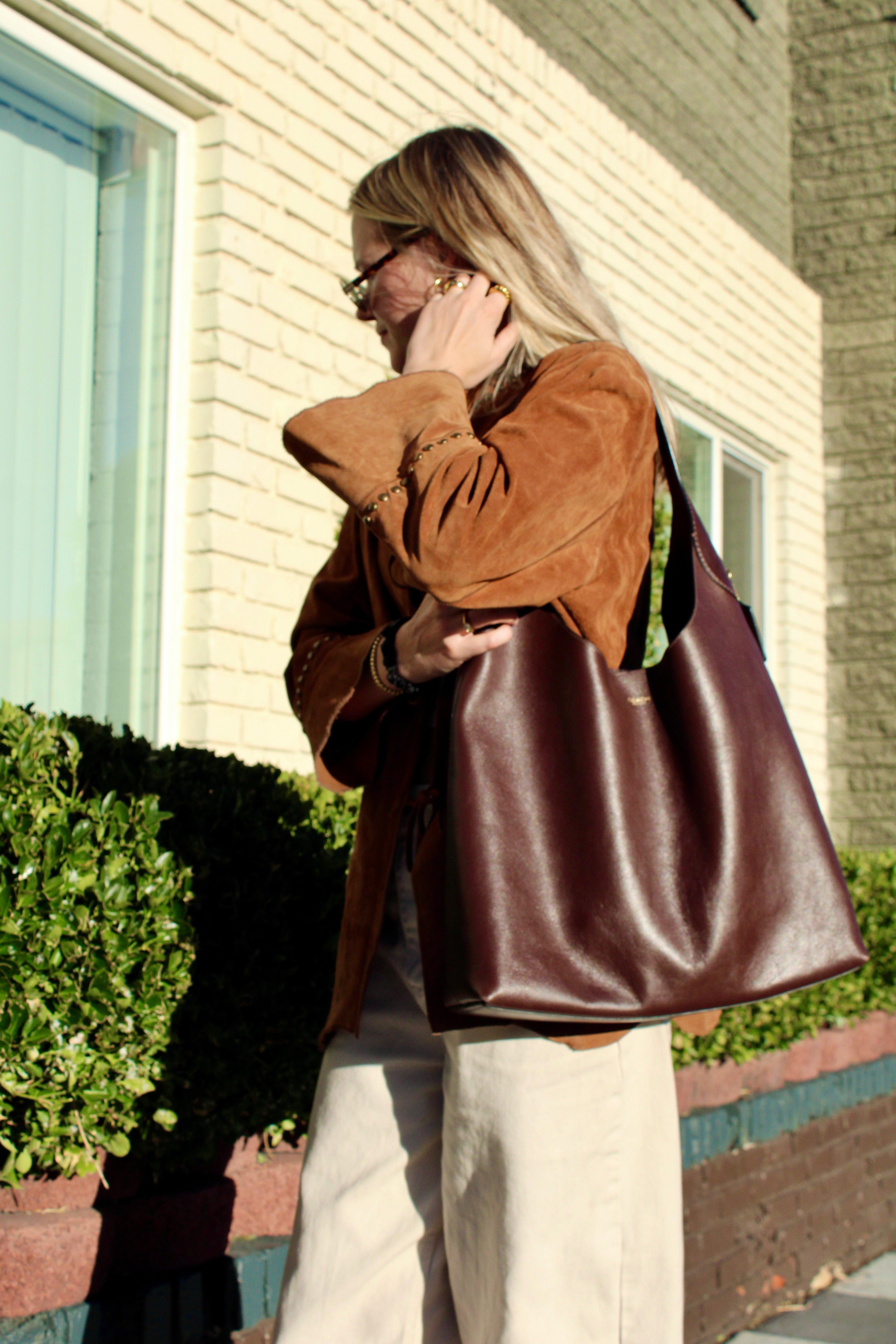 Model carrying a Brooklyn bag over the shoulder