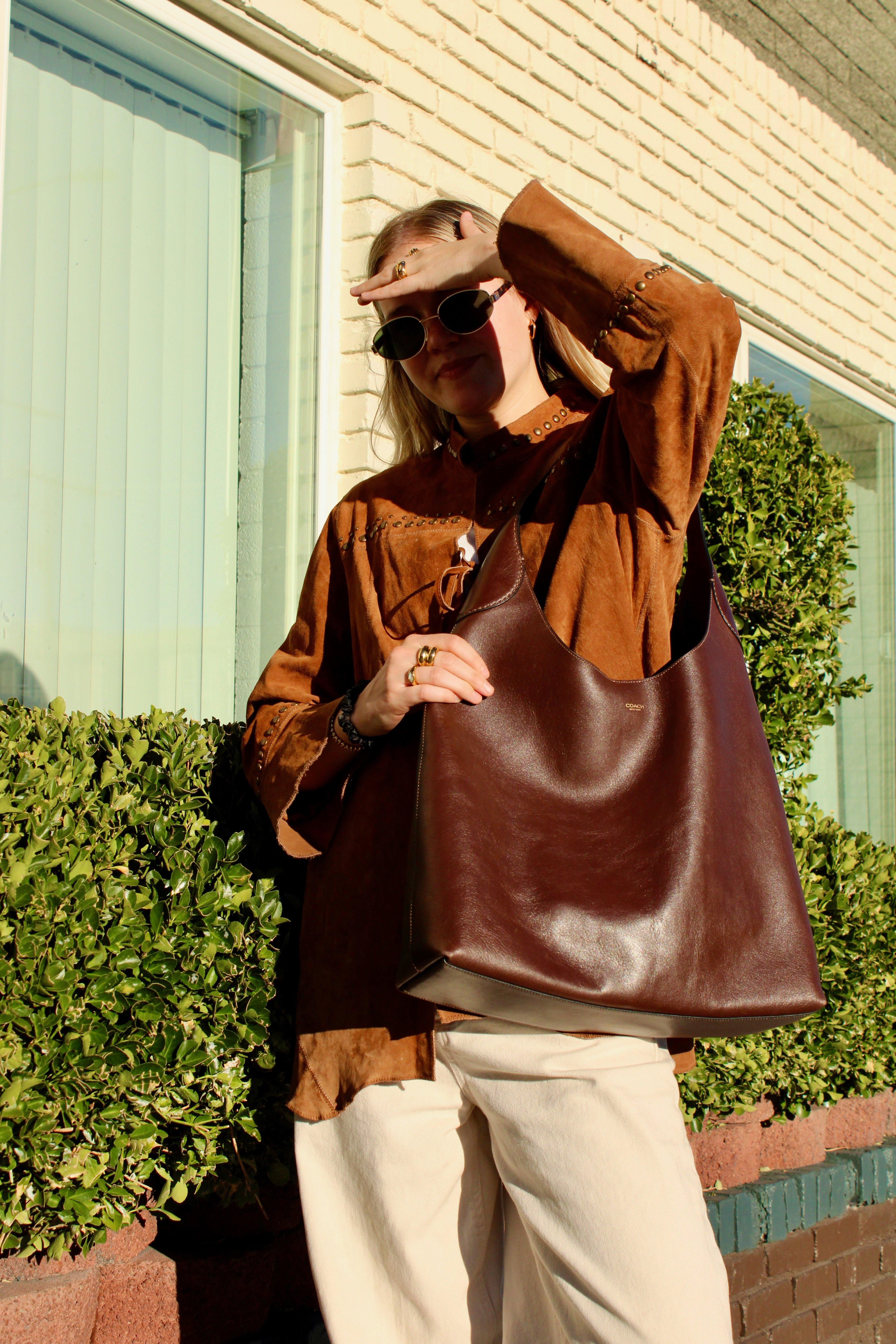 Model styling a Brooklyn bag