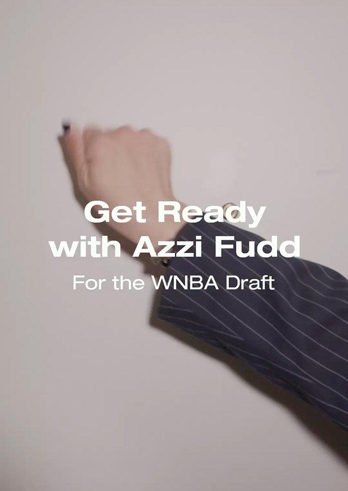 Person wearing pinstriped blazer with text Get Ready with Azzi Fudd For the WNBA Draft.
