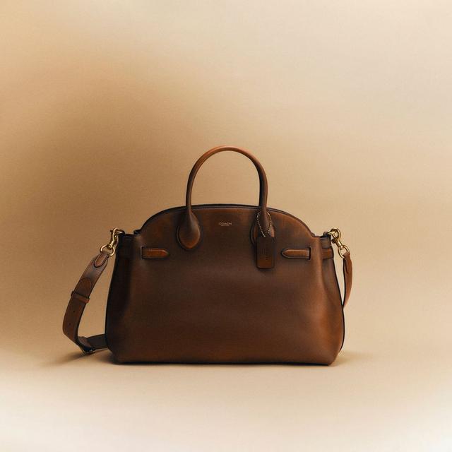 Coach brown leather satchel handbag with top handles and detachable crossbody strap.