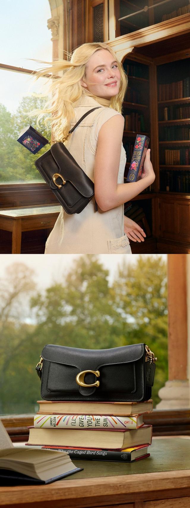 Black leather Coach shoulder bag with gold C hardware displayed on stacked books in a library setting.