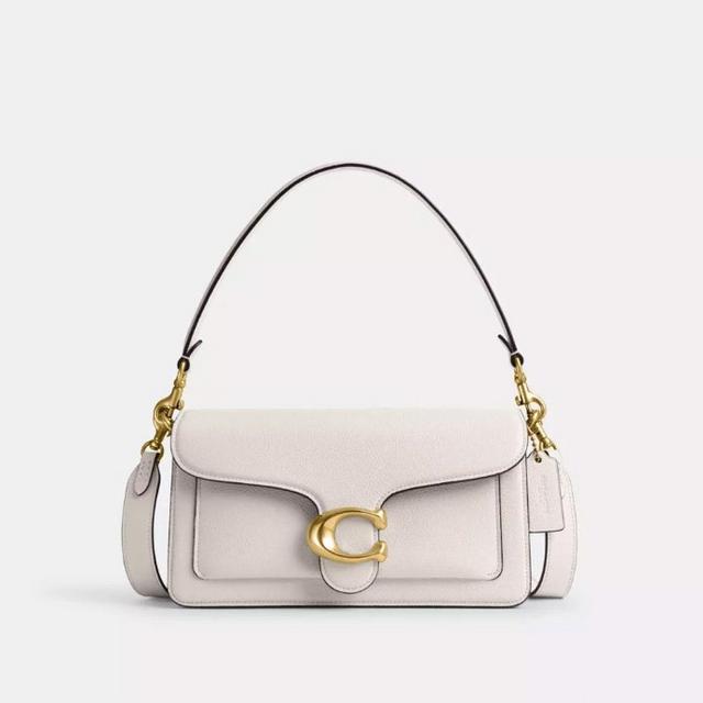White leather shoulder bag with gold C-shaped clasp and adjustable dark strap.