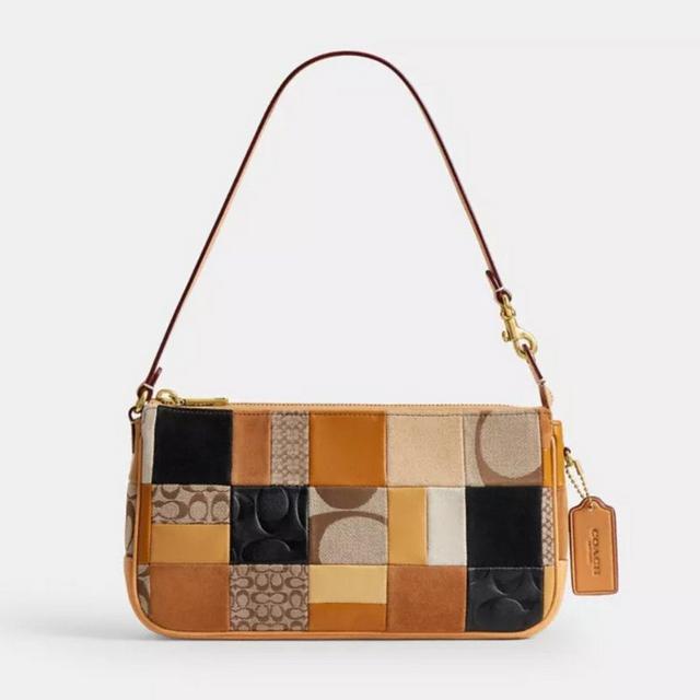 Coach patchwork shoulder bag in tan, black, and neutral tones with leather strap and logo tag.