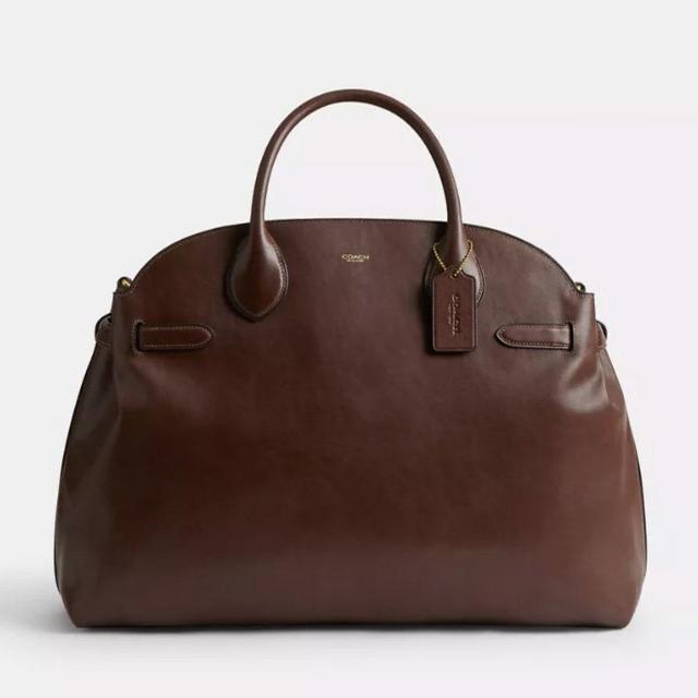 Brown leather dome-shaped handbag with dual handles and detachable shoulder strap.