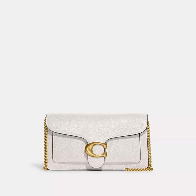 White leather clutch with gold chain strap and signature C-shaped clasp closure.