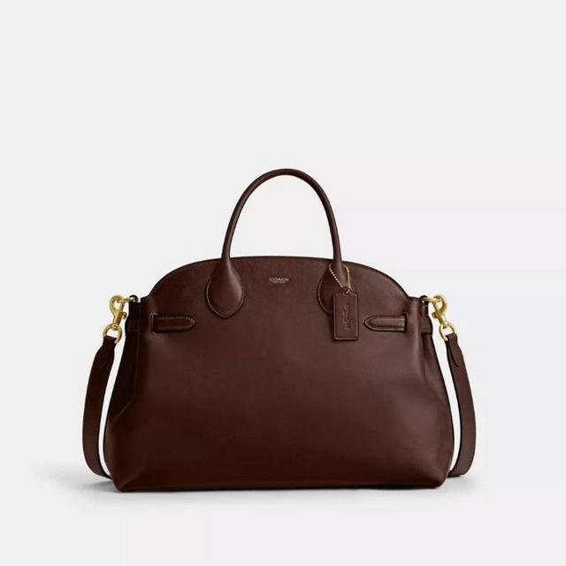 Brown Coach leather handbag with top handles, detachable shoulder strap, and gold hardware accents.