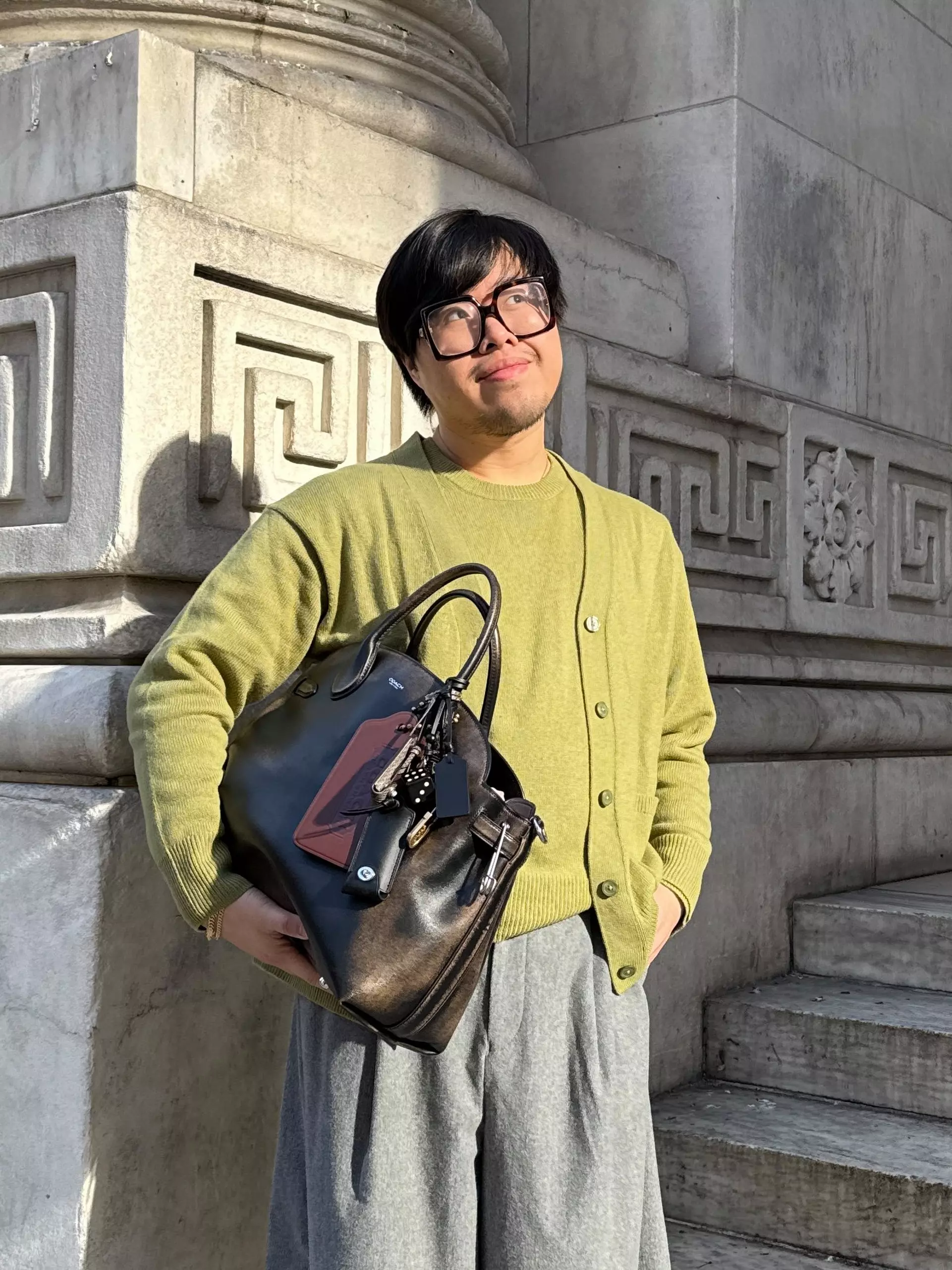 Model carrying an oversized carryall
