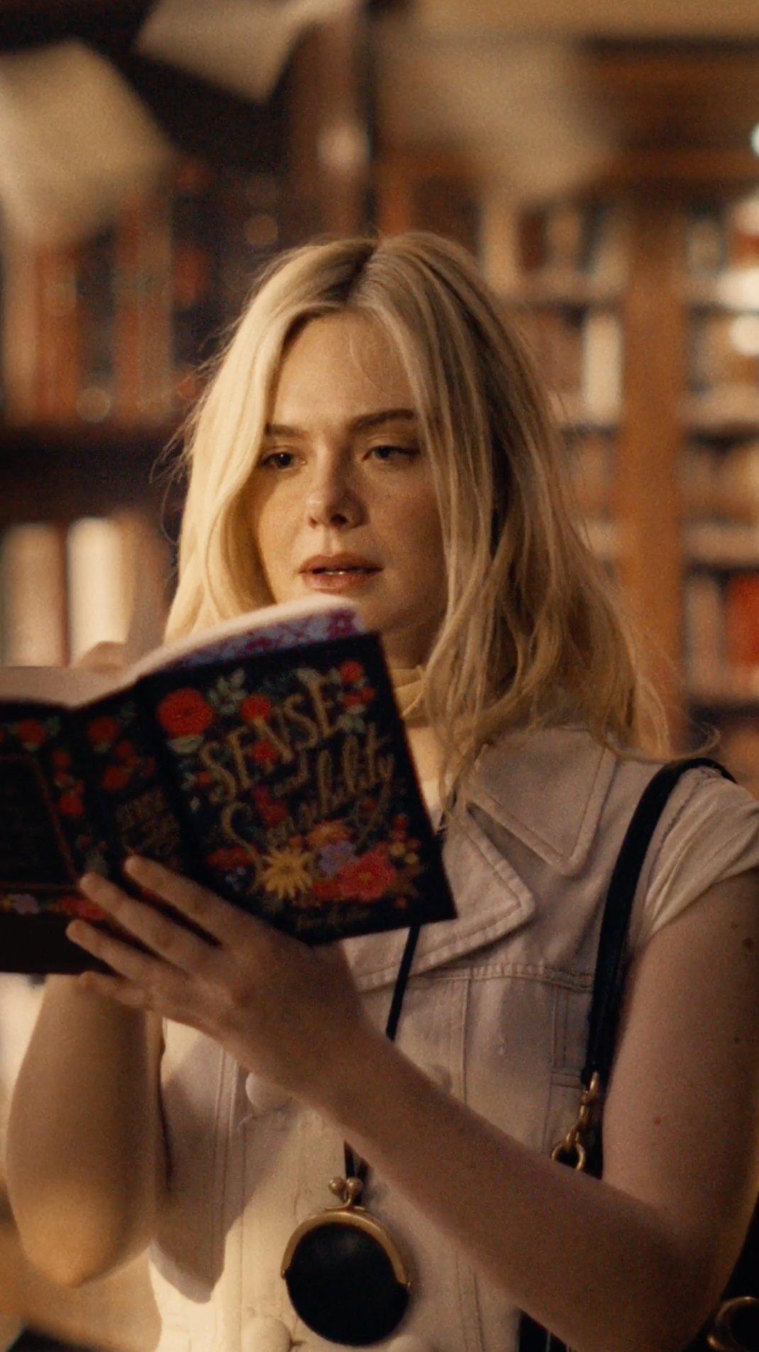 Elle Fanning wearing a black Tabby Shoulder Bag 26 in soft grain leather in Coach Spring 2026 Découvrez votre histoire campaign