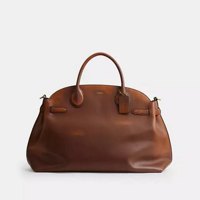 Brown leather satchel bag with top handles and detachable shoulder strap.