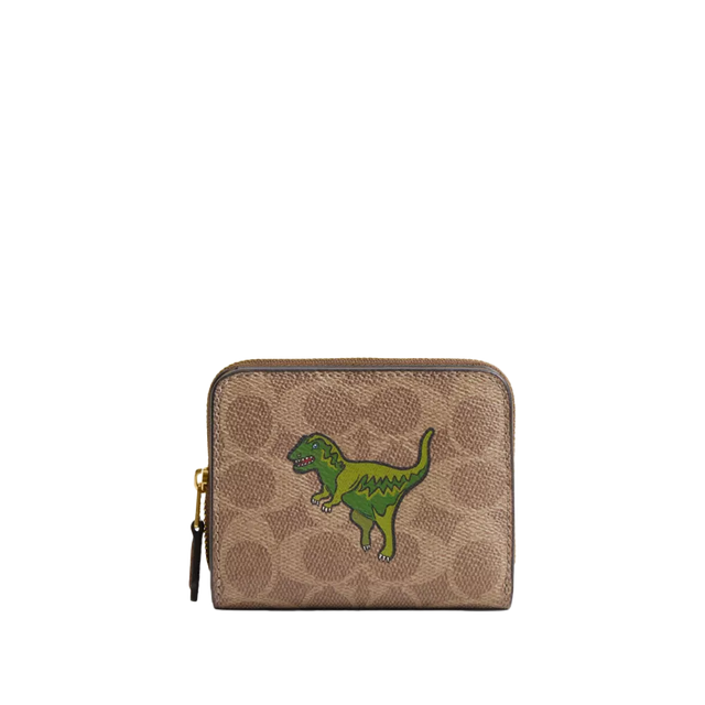 coach small zip wallet with a green dinosaur on it