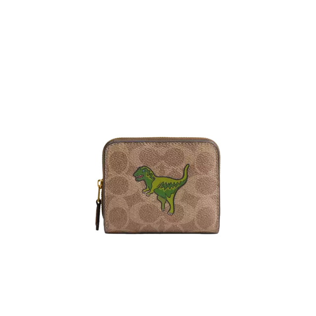 coach small zip wallet with a green dinosaur on it