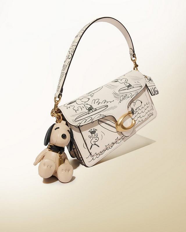 a collection of purses with cartoon characters on them
