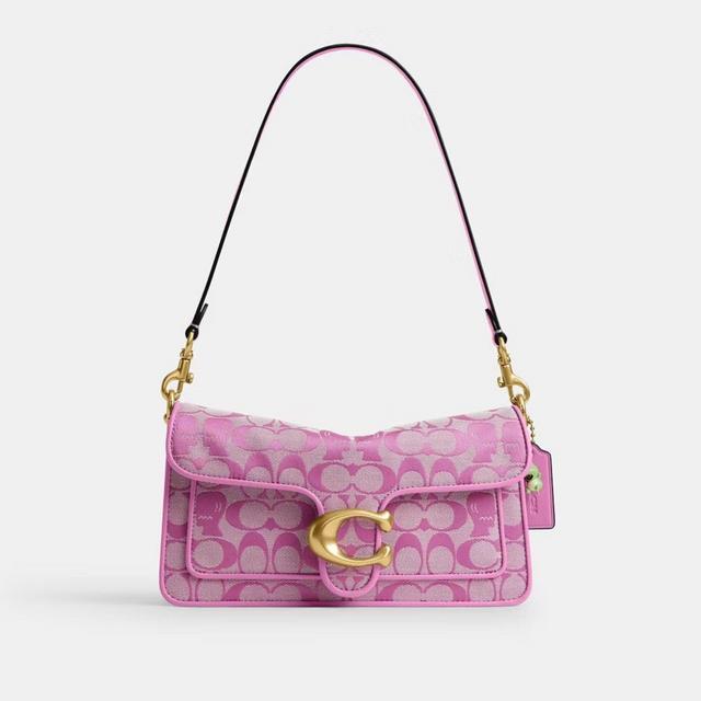 Pink Coach shoulder bag with signature logo pattern and gold hardware.