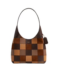Brown and tan checkered shoulder bag with single strap and small hanging tag.