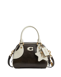 Coach mini dome satchel in brown suede with cream leather trim and detachable crossbody strap.