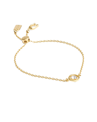 Gold chain bracelet with interlocking circular pendant featuring small clear stones.