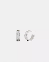 Silver hoop earrings with three small embedded crystals on the outer surface.