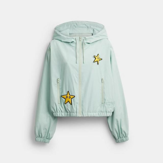 This cropped, hooded windbreaker features eye-catching, expressive star motifs.